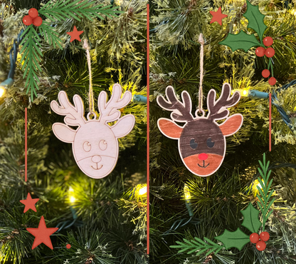 Two wooden reindeer ornaments on a Christmas tree with lights and decorations.