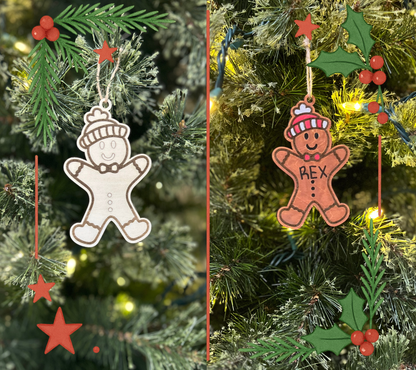 Two gingerbread man ornaments on a Christmas tree with greenery and lights.