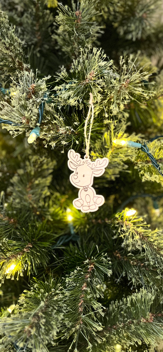 Decorative reindeer ornament on a Christmas tree with lights.